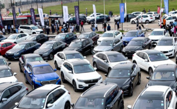 Nigeria’s Auto Market Shifts Toward Hybrid, Tech-Focused SUVs at Abuja Fair Rows of new hybrid and electric SUVs on display at the Abuja Motor Fair