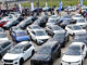 Rows of new hybrid and electric SUVs on display at the Abuja Motor Fair