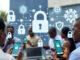 Nigerians using smartphones and laptops surrounded by glowing digital shields and padlocks, symbolizing secure VPN protection in an urban Lagos setting.