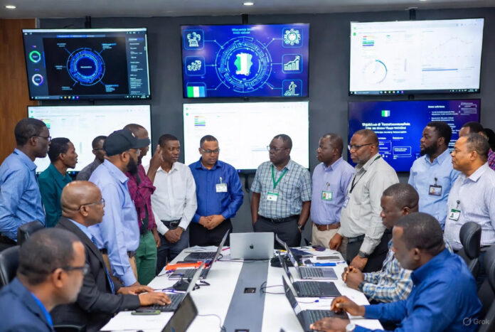 FIRS Leads Tech-Driven Tax Revolution at MARCON Retreat FIRS officials and experts gather in a high-tech command center during the MARCON Retreat, surrounded by large digital screens displaying tax data, analytics, and Nigeria-focused tech solutions.