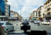 Nigeria Becomes Key Growth Market as Bolt Dash Cam Enrolment Hits 1,596 Drivers Alt Text: Bolt driver in Lagos installs a dash cam on his windshield while other ride-hailing cars queue on a busy city street, symbolizing rapid safety-tech adoption.