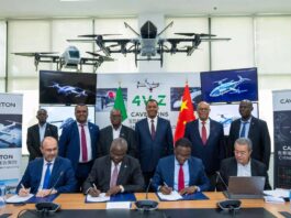 Caverton and Chinese university officials sign an MoU at a formal ceremony, surrounded by advanced UAV prototypes, Nigerian and Chinese flags, and digital drone displays.