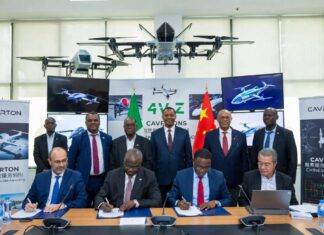 Caverton and Chinese university officials sign an MoU at a formal ceremony, surrounded by advanced UAV prototypes, Nigerian and Chinese flags, and digital drone displays.