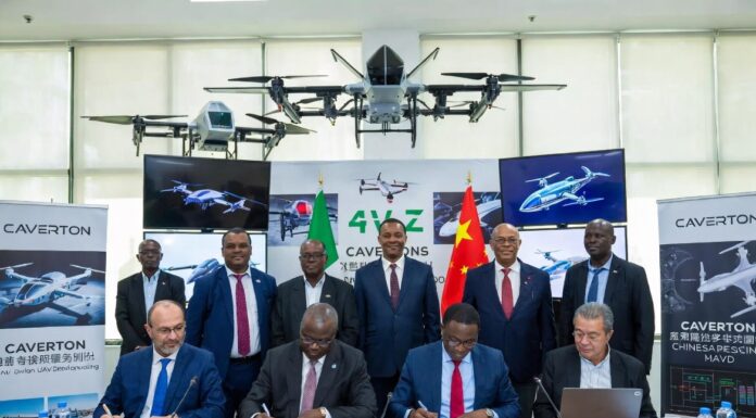 Caverton and Chinese university officials sign an MoU at a formal ceremony, surrounded by advanced UAV prototypes, Nigerian and Chinese flags, and digital drone displays.