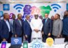 Nigeria’s Internet Custodian Celebrates 20 Years with Nationwide Digital Literacy Initiative Diverse group of Nigerian tech leaders, entrepreneurs, and developers in a modern office brainstorming around laptops and data charts, symbolizing Nigeria’s ambition to lead Africa in AI innovation.