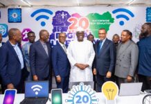 Nigeria’s Internet Custodian Celebrates 20 Years with Nationwide Digital Literacy Initiative Diverse group of Nigerian tech leaders, entrepreneurs, and developers in a modern office brainstorming around laptops and data charts, symbolizing Nigeria’s ambition to lead Africa in AI innovation.