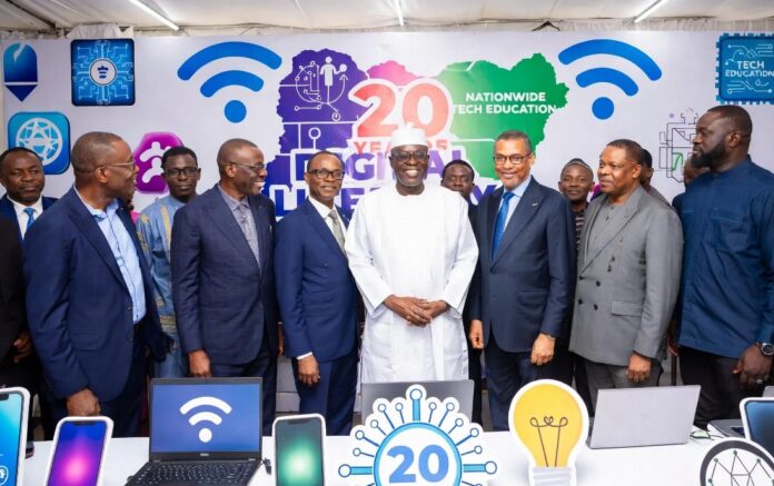 How Nigeria Can Become Africa’s Leading Artificial Intelligence Powerhouse Diverse group of Nigerian tech leaders, entrepreneurs, and developers in a modern office brainstorming around laptops and data charts, symbolizing Nigeria’s ambition to lead Africa in AI innovation.