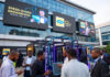 MTN Nigeria Introduces Speed-Based Unlimited Broadband Data Plans Crowd of excited Nigerians outside MTN headquarters in Lagos, with large digital screens announcing “Speed-Based Unlimited Broadband Data Plans”.