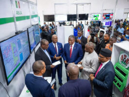 INEC officials and citizens celebrate the unveiling of biometric voting machines and digital result systems in Abuja.