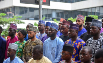 Nigeria and Others Risk Digital Colonisation Without Data Ownership, Warns Remita Nigerian tech leaders stand united under glowing digital screens, with shadowy global tech giants looming in the background.