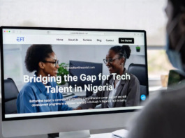 Nigerian tech founder and recruiter smiling at a large monitor displaying the Bottomline Assist platform with the headline “Bridging the Gap for Tech Talent in Nigeria” and profiles of skilled developers.