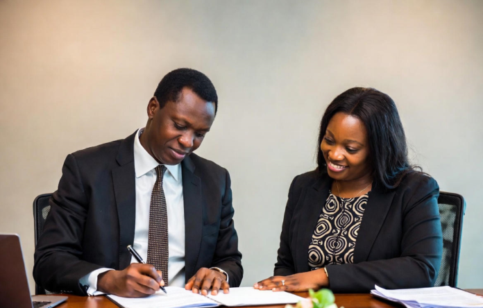 Executives from Siemens Healthineers and NSIA signing a major agreement while surrounded by advanced MRI, CT scanners and digital diagnostic screens in a modern Nigerian hospital setting. Siemens Healthineers & NSIA Sign Landmark 10-Year Deal to Revolutionise Diagnostic Healthcare in Nigeria