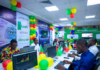 LemFi Launches USD & GBP Global Accounts in Nigeria Excited Nigerians at a colourful launch event with green, white and yellow balloons, using laptops to open LemFi USD and GBP global accounts on the app.