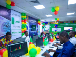 LemFi Launches USD & GBP Global Accounts in Nigeria Excited Nigerians at a colourful launch event with green, white and yellow balloons, using laptops to open LemFi USD and GBP global accounts on the app.