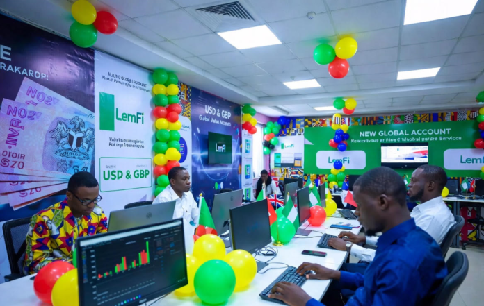LemFi Launches USD and GBP Global Accounts for Nigerians, Enabling Seamless International Payments Excited Nigerians at a colourful launch event with green, white and yellow balloons, using laptops to open LemFi USD and GBP global accounts on the app.