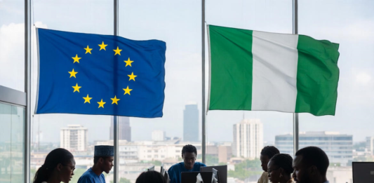 EU Commits €45 Million to Boost Nigeria’s Digital Economy Nigerian and European officials in a modern conference room with EU and Nigerian flags, collaborating on laptops against a Lagos city skyline, symbolising partnership in digital innovation.