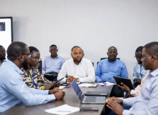 Lagos Government Partners with Russia to Enhance Energy and Technology Sectors Lagos State Governor and Russian officials shaking hands in front of Nigerian and Russian flags, with digital overlays of power grids, renewable energy plants and smart city technology.