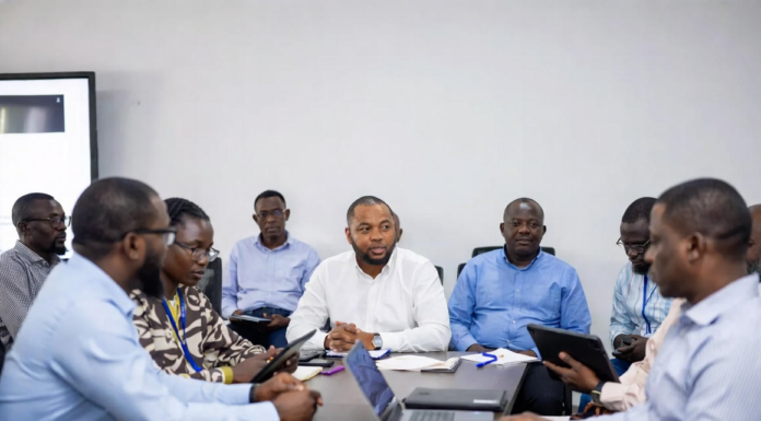 Lagos State Governor and Russian officials shaking hands in front of Nigerian and Russian flags, with digital overlays of power grids, renewable energy plants and smart city technology.