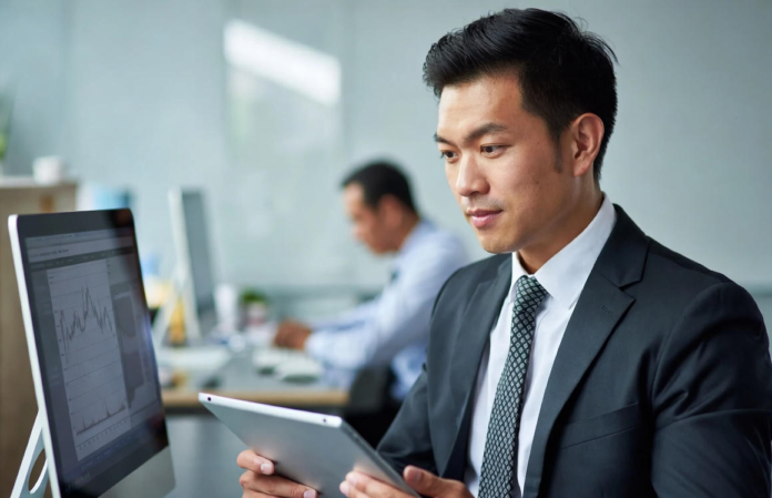 Bottomline Assist Solves Nigeria’s Tech Talent Shortage with Fast, Affordable Hiring Platform Nigerian tech recruiters and company founders smiling while reviewing profiles of pre-vetted software engineers, data scientists and product managers on laptops in a modern Lagos office.