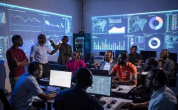 Nigeria Launches Cutting-Edge Training to Combat Tech-Driven Human Trafficking and Violence Nigerian cybercrime investigators and law enforcement officers wearing headsets in a futuristic command centre, tracking dark-web trafficking networks and cryptocurrency trails on massive glowing screens.